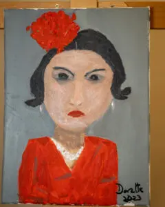 A painting of a woman with red hair and a bow on her head.